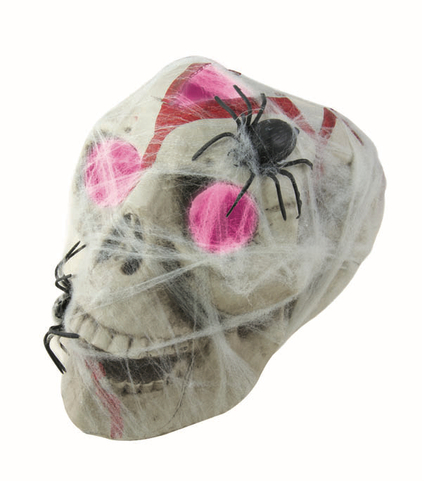 crâne en plastique lumineux avec toile et araignées halloween